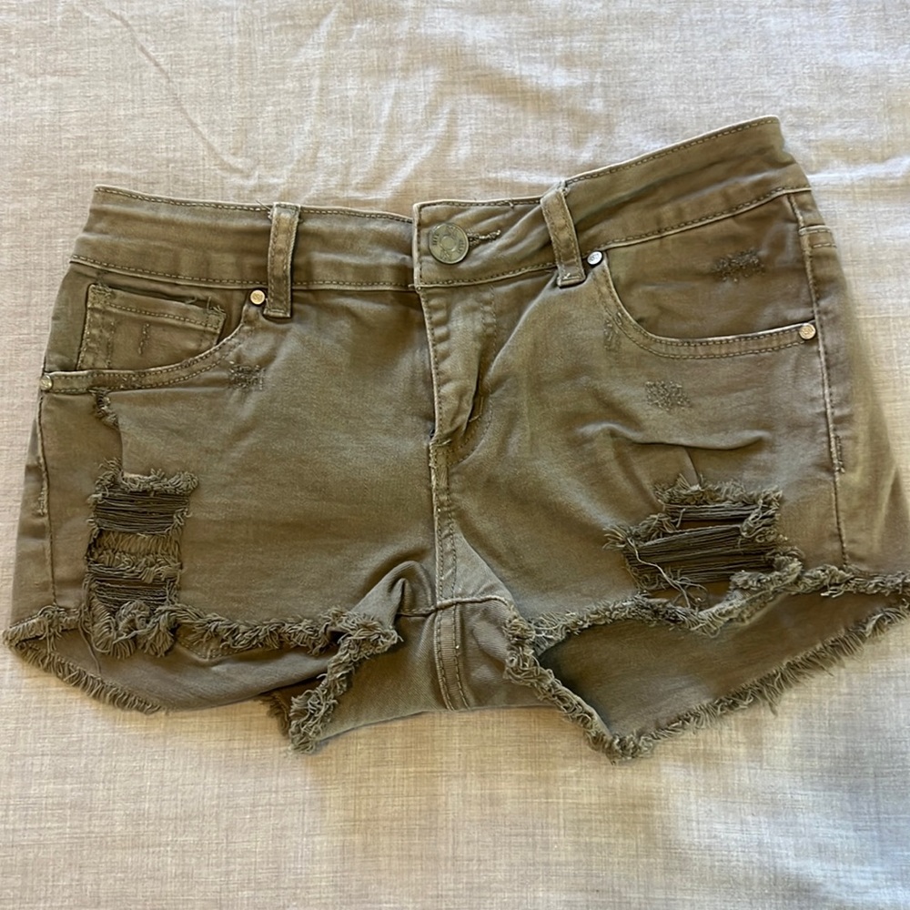Super cute army green cut off distress shorts.